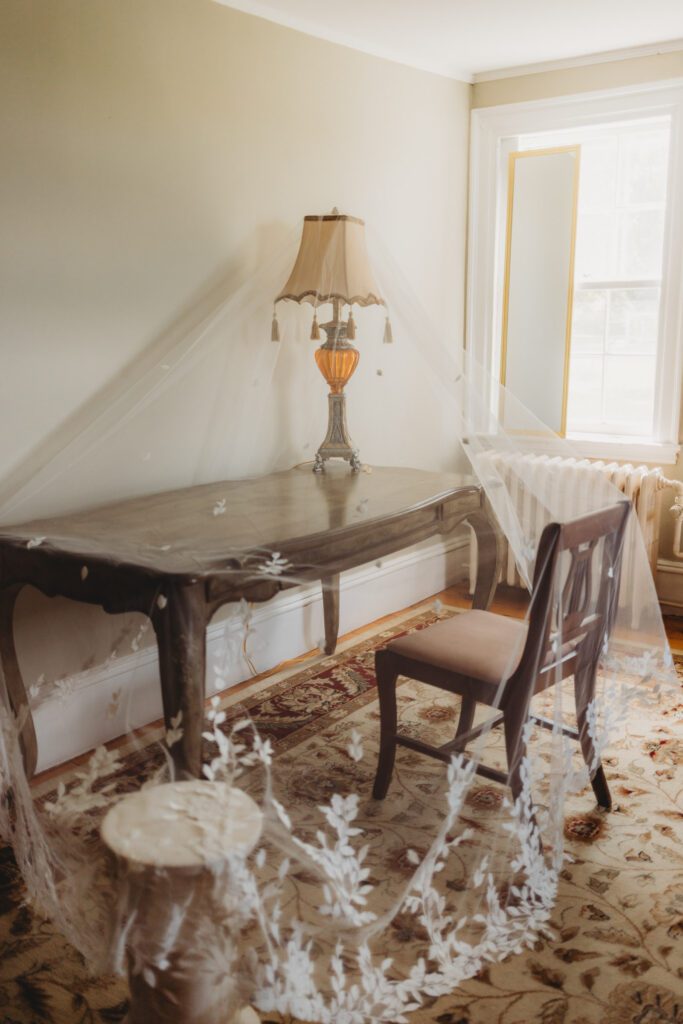 A brides veil hanging in the getting ready suite at The Evermore at Peirce Farm Estate in Topsfield, Massachusetts.