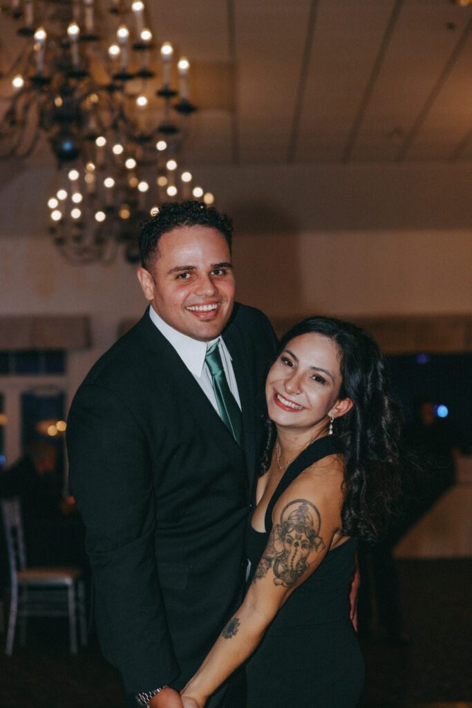 Guests smiling while they dance ar classy reception at Black Swan Country Club in Georgetown, Massachusetts.