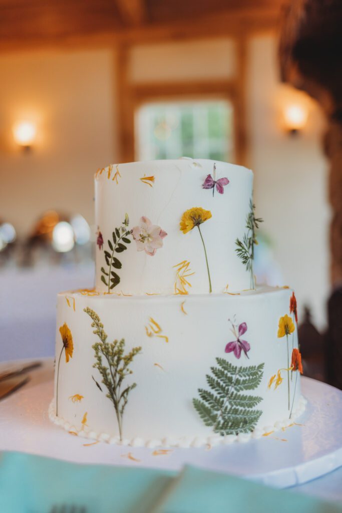 Wild flower wedding cake for whimsical summer wedding at Peirce Farm Estate in Topsfield, Massachusetts.