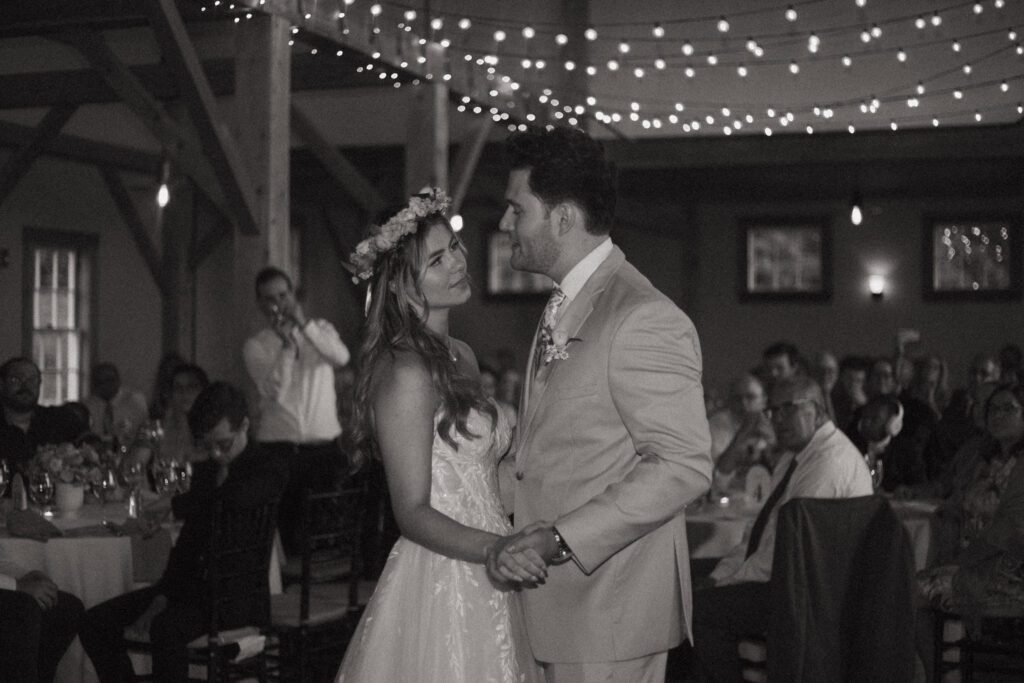 Bride and groom looking at each or during their first dance at Peirce Farm Estate in Topsfield, Massachusetts.