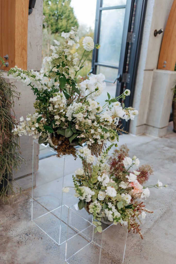 Flower display for wedding ceremony for greenhouse wedding at Tower Hill in Boylston, Massachusetts.