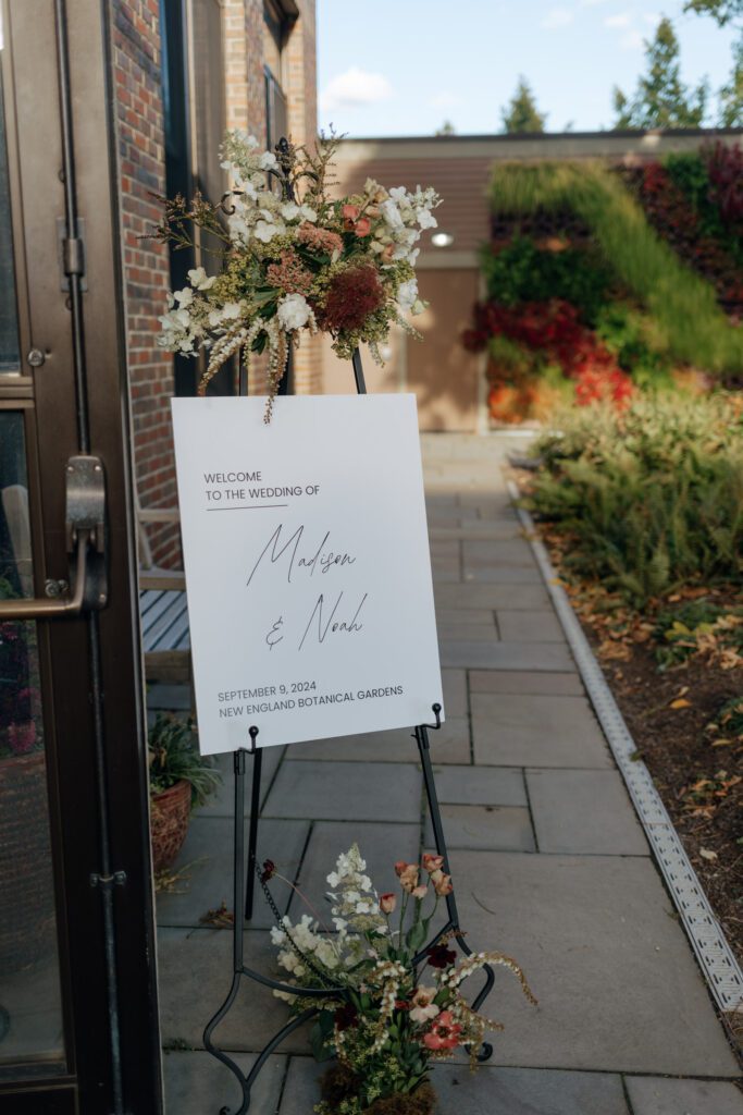 Welcome sign for romantic greenhouse wedding at Tower Hill in Boylston, Massachusetts.