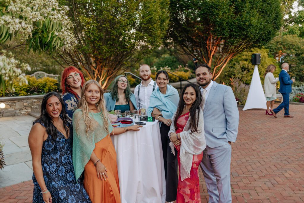 Guests smiling during cocktail house at Tower Hill in Boylston, Massachusetts.