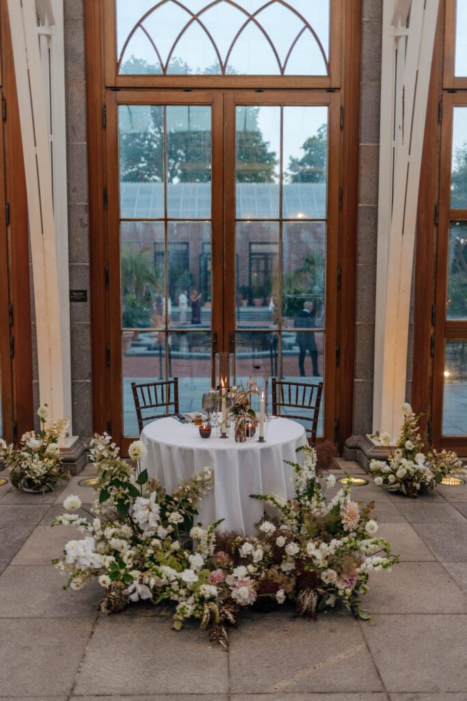 Bride and grooms sweetheart table at greenhouse wedding at Tower Hill in Boylston, Massachusetts.