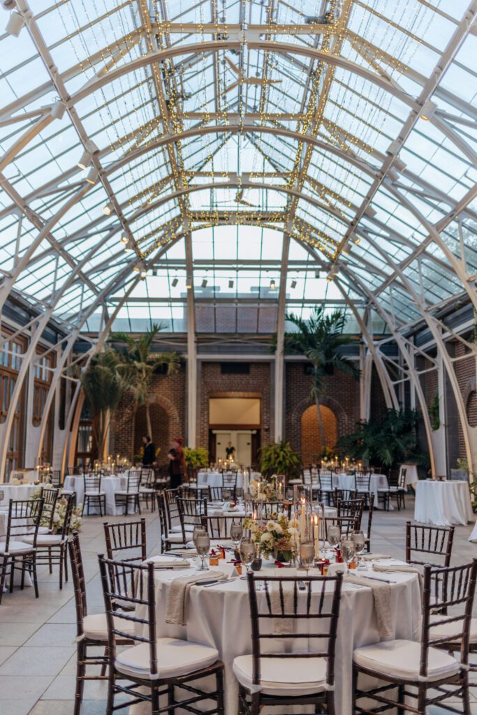 Romantic greenhouse wedding reception set up at Tower Hill in Boylston, Massachusetts.