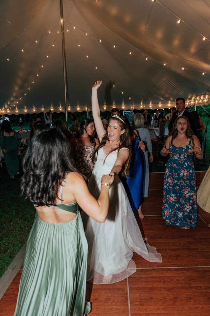 Bride and guest dancing on exciting dance floor in Massachusetts.