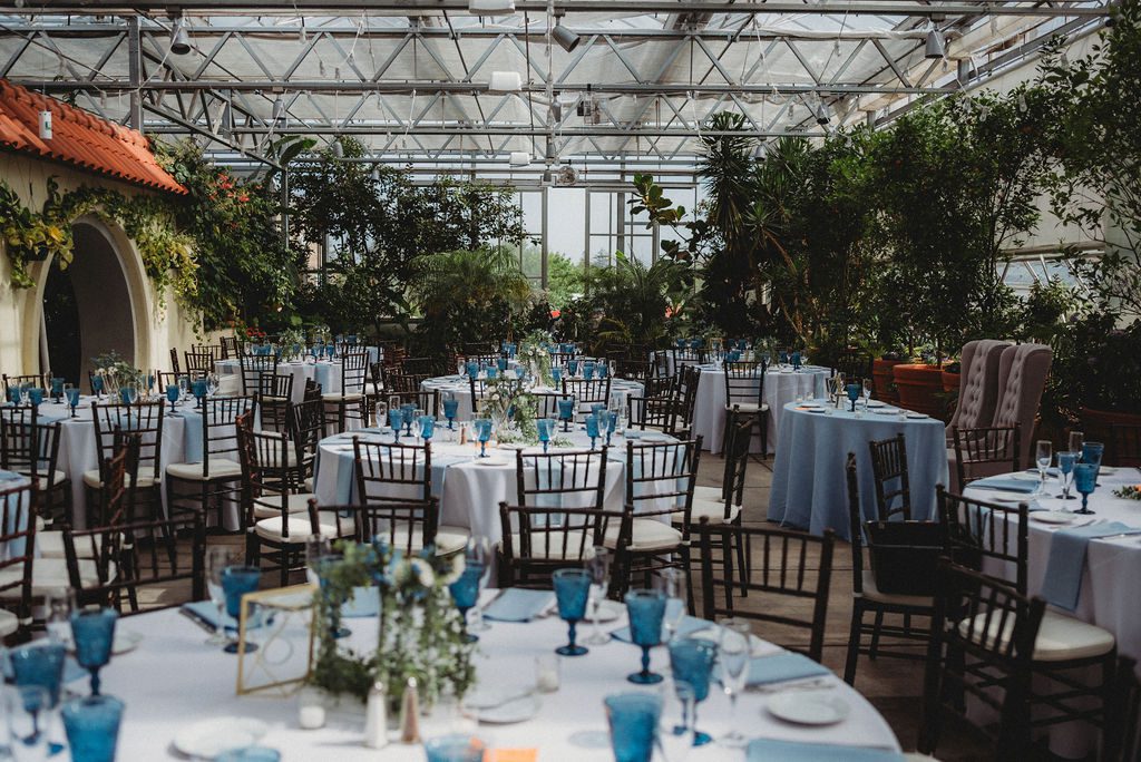 Table decoration for blue theme greenhouse wedding Roger Williams Botanical Garden Park in Providence Rhode Island.