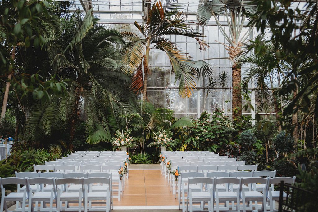 Ceremony setup in greenhouse with with chairs at Roger Williams Botanical Garden Park in Providence Rhode Island