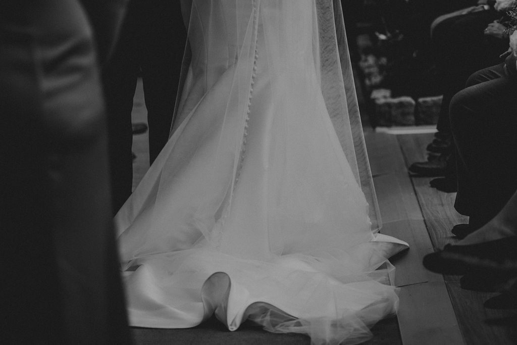 Bride's wedding dress train in the greenhouse at Roger Williams Botanical Garden Park in Providence, Rhode Island.